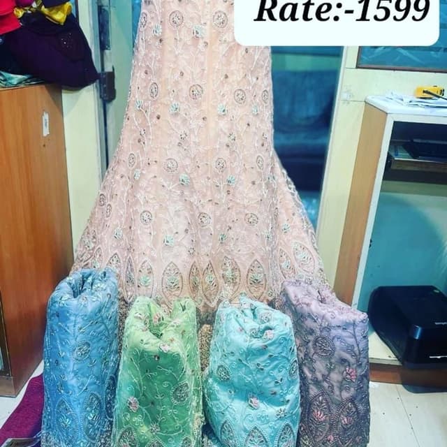 Peach, with accents of blue, green, and lavender Lehenga