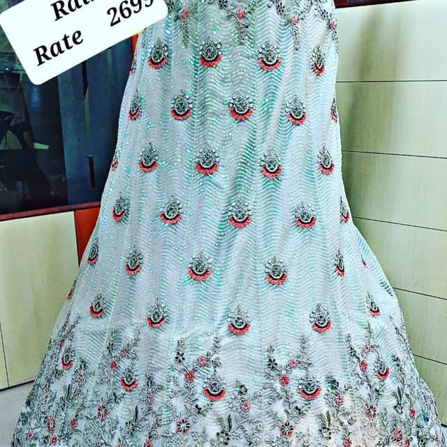 Light blue, silver, red, and green Lehenga