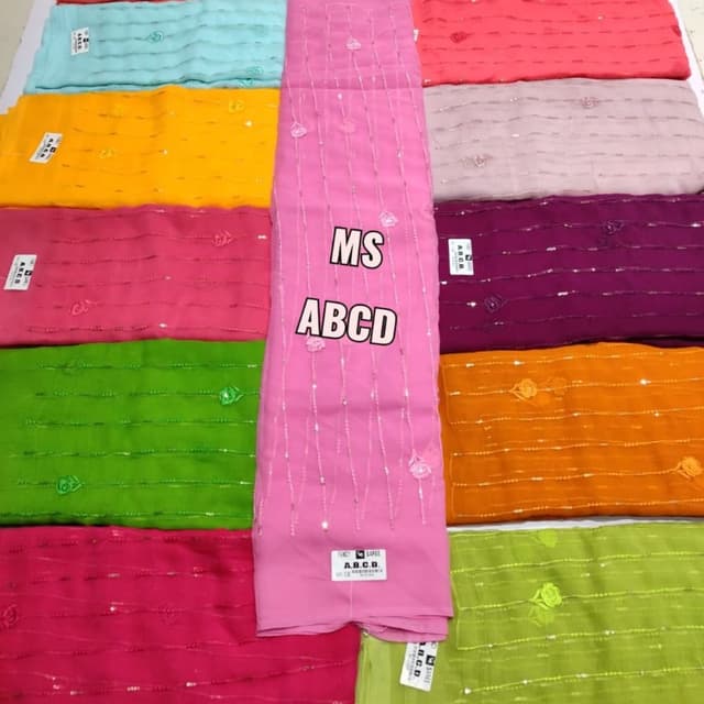 Pink, with various other vibrant colors including turquoise, yellow, pink, green, orange, and purple Saree