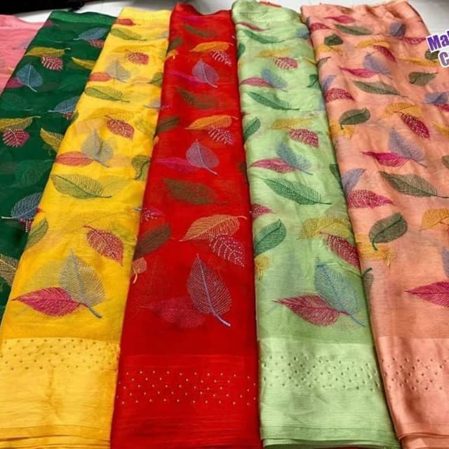 Various - Green, Yellow, Red, Green, and Peach backgrounds with leaf patterns in complementary colors like pink, brown, and yellow. Saree