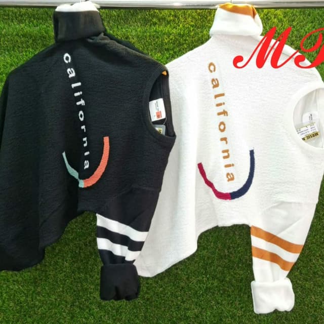 Black and White with accent colors of orange, green, red and navy blue Sweater
