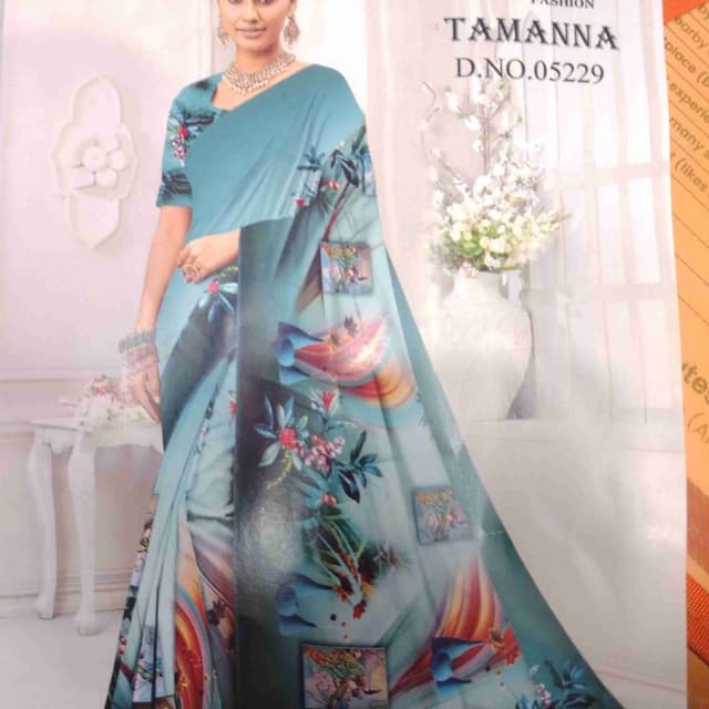Light blue, with floral and artistic print including shades of red, orange, green, and blue. Saree