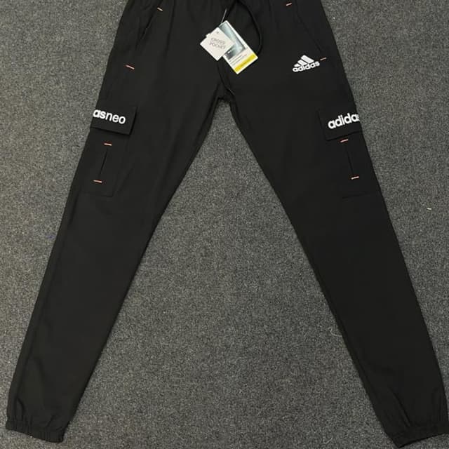 Black with white and peach accents Pants