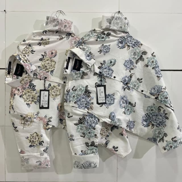 White with a floral print in shades of pink, yellow, blue, and green. Shirt