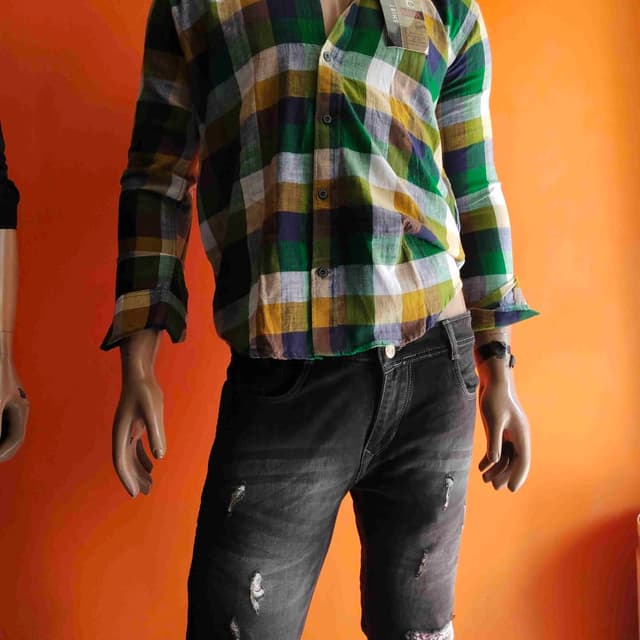 Green, Yellow, Blue, White, and Black Shirt and Jeans
