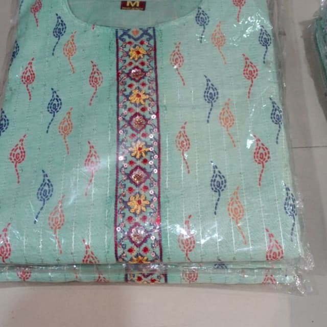 Seafoam green base with accents of red, orange, and blue. Kurti