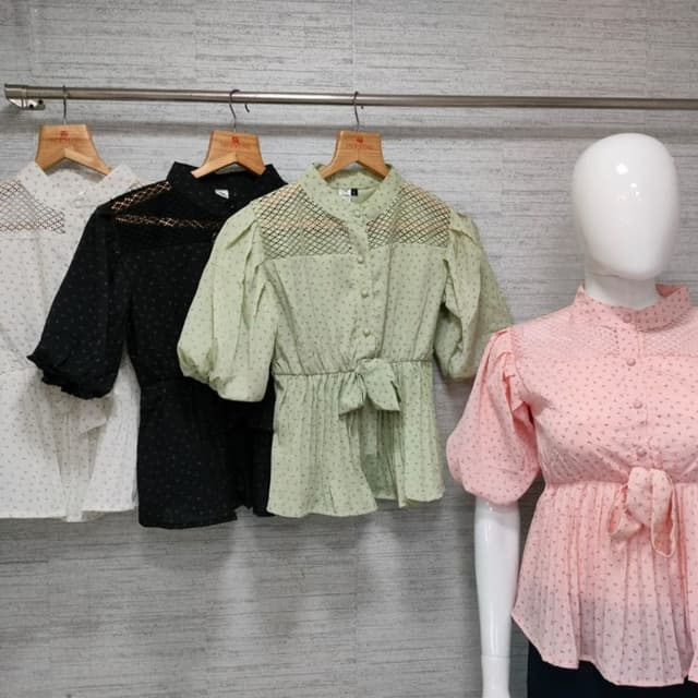 Various pastel colors, including white, black, light green, and pink. Each top features a different color. Blouse