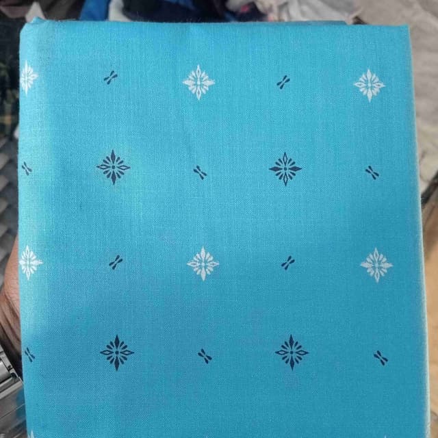 Aqua blue with white and dark blue patterns Fabric
