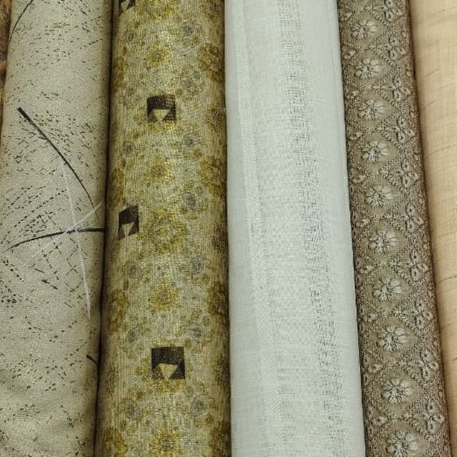 Earthy tones of beige, gold, and cream Fabric Rolls