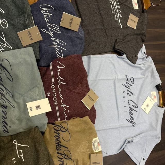 Various, including blues, grey, brown, and tan. T-shirts and/or Sweatshirts