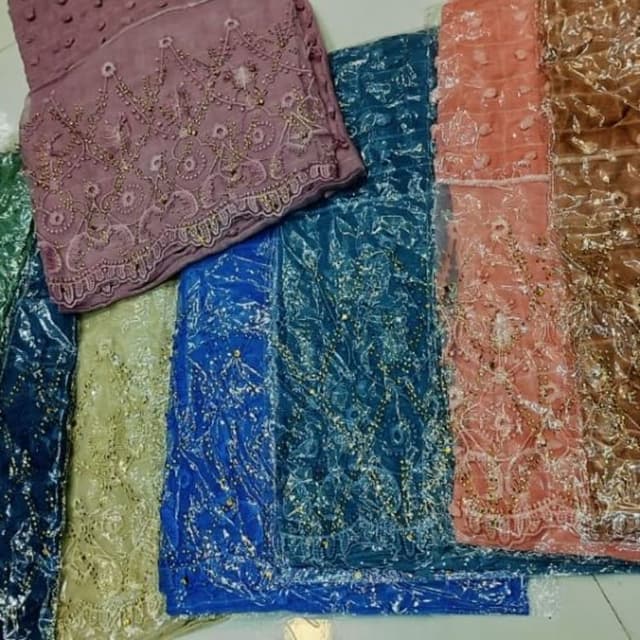 Various shades including dusty rose, blue, teal, peach, and brown Fabric