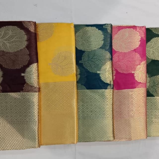 Various, including deep maroon, yellow, teal, fuchsia, and dark green with gold accents Saree