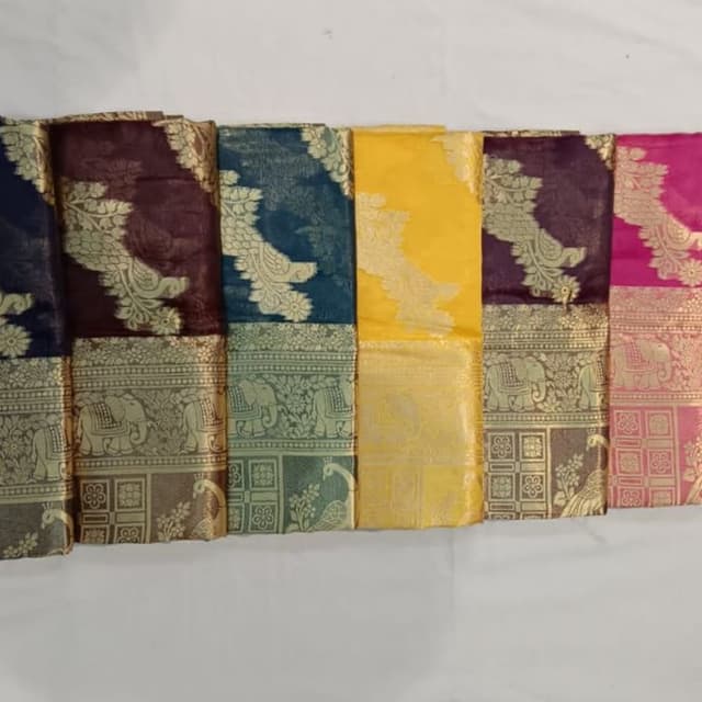Various rich colors including navy, burgundy, teal, yellow, purple, and pink with gold accents Saree
