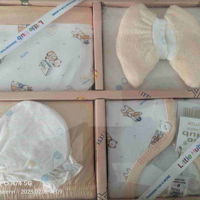 Pastel pink, white, and light blue Baby clothing set