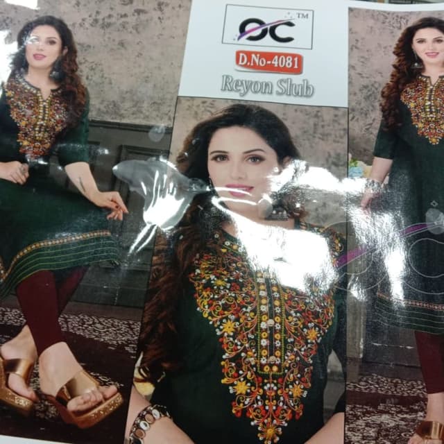 Dark Green with multi-colored embroidery (yellow, orange, red, and green) Kurti