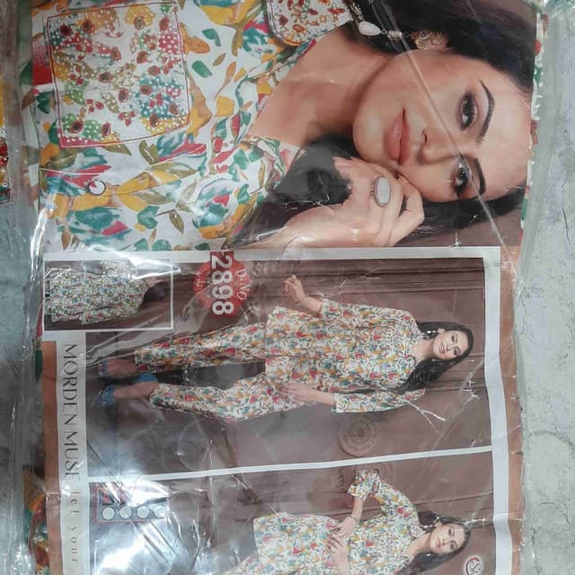 White base with floral prints in yellow, green, and red Pajama set