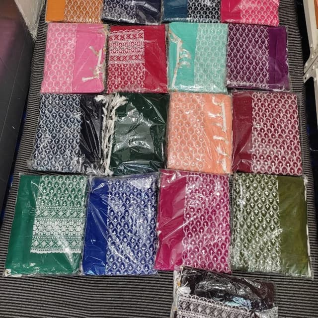 Variety of colors including pink, red, green, blue, peach, purple, and orange. Unstitched Suit Sets
