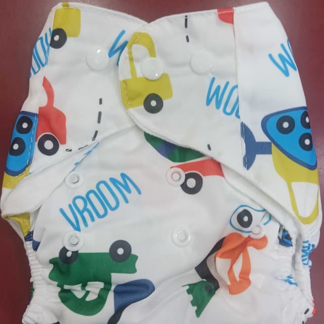 White, with primary colors like red, yellow, green, and blue Cloth Diaper
