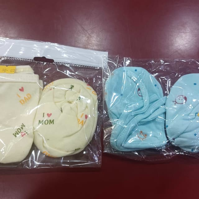 Pastel shades of yellow and blue Baby Mittens