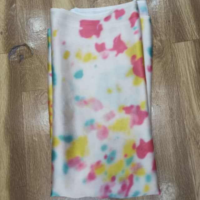 White base with pink, yellow, and turquoise splotches Fabric/Scarf