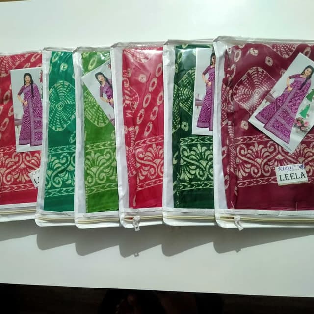 Red, Green, and variations with white patterns. Saree