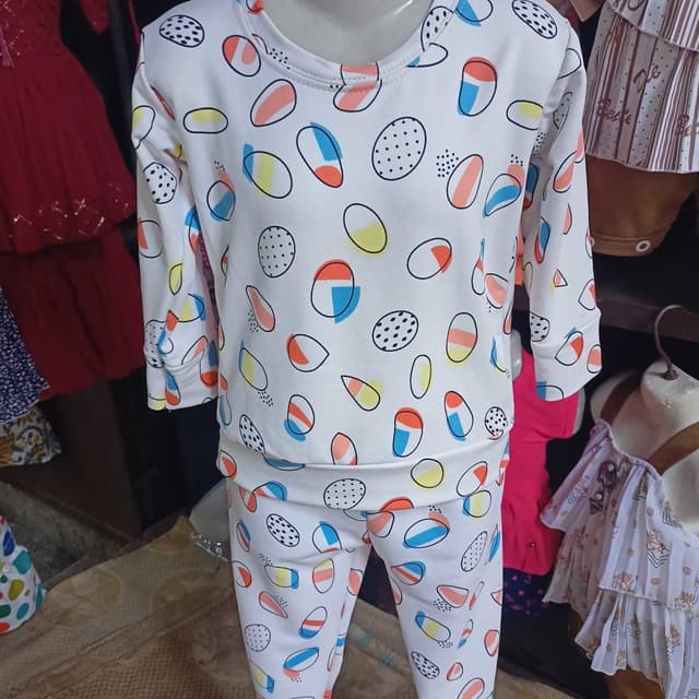 White base with a colorful pattern including blue, orange, yellow, and black Kids' Pajama Set