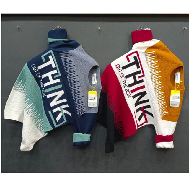 Multi-colored - predominantly blues, greens, white, red, black, and gold. Sweater