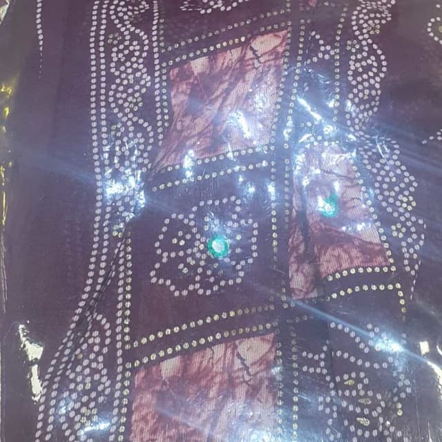 Dark purple, maroon, white, and gold Saree or similar fabric