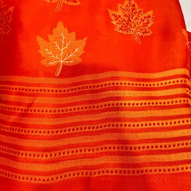Orange and shades of orange Saree or similar textile