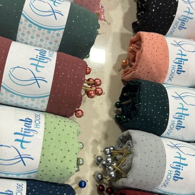 Various, including shades of green, maroon, peach, black, and grey. Hijab