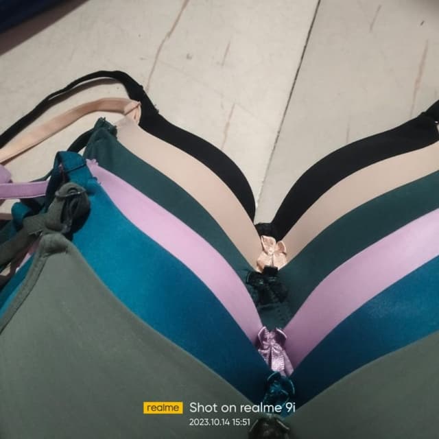 Various, including green, teal, pink, beige, and black Bra