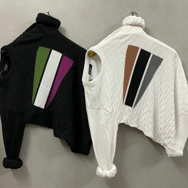 Black/White with a multicolored geometric pattern. Sweater