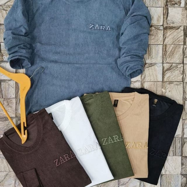 Various, including blue, brown, white, olive green, tan, and black Sweater