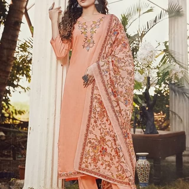 Peach, with a floral print in shades of peach, orange, yellow, blue, and green. Salwar Kameez with Dupatta