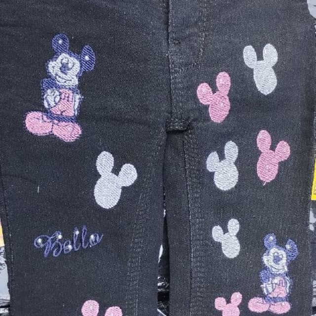 Black with pink, blue, and white accents Jeans