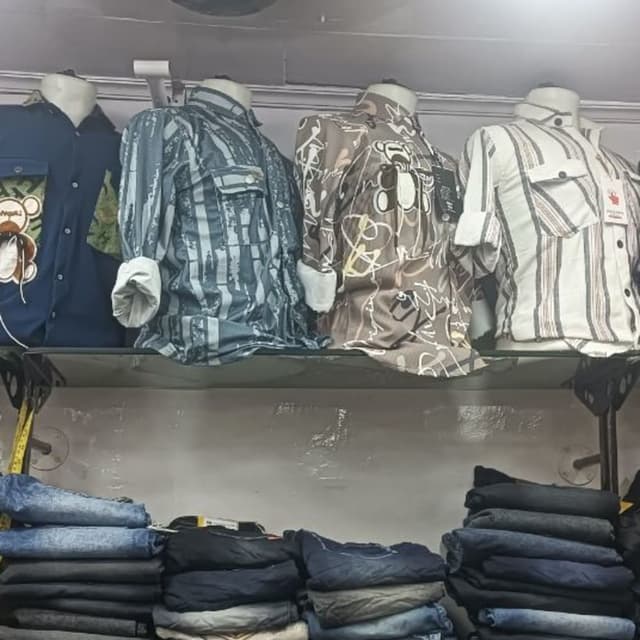 Various patterns, including blue and white stripes, brown with white swirls and a teddy bear design, and blue with vertical faded lines Shirts
