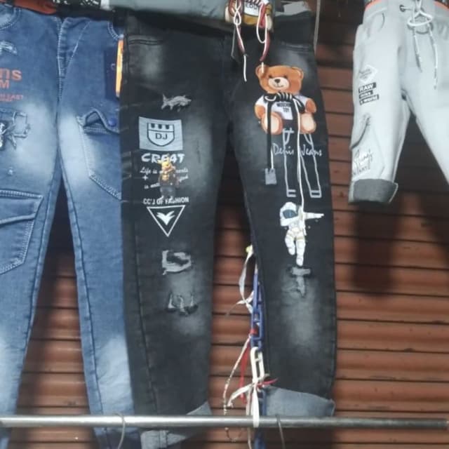 Black with white and tan accents Jeans