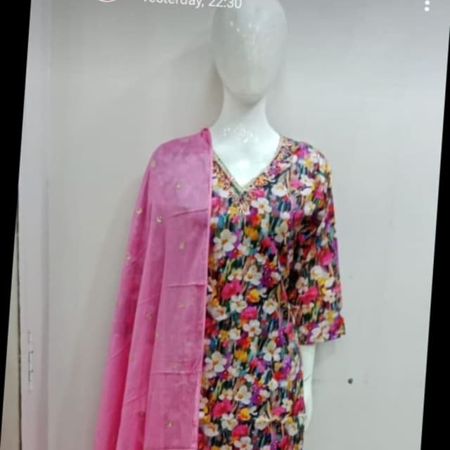 Multicolor floral print on a dark background with a bright pink dupatta. Salwar Kameez with Dupatta