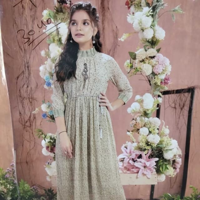 Soft beige with a subtle floral print and sage green accents Dress