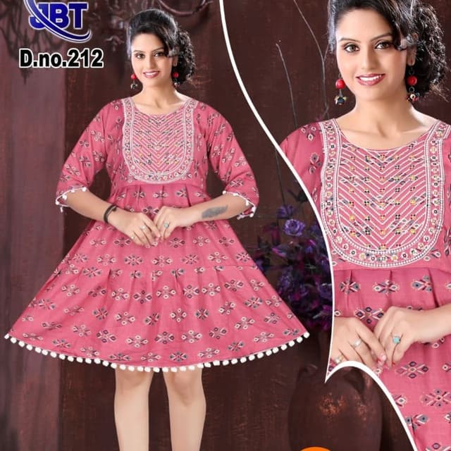Pink with white and a touch of other colors in the embroidery Dress