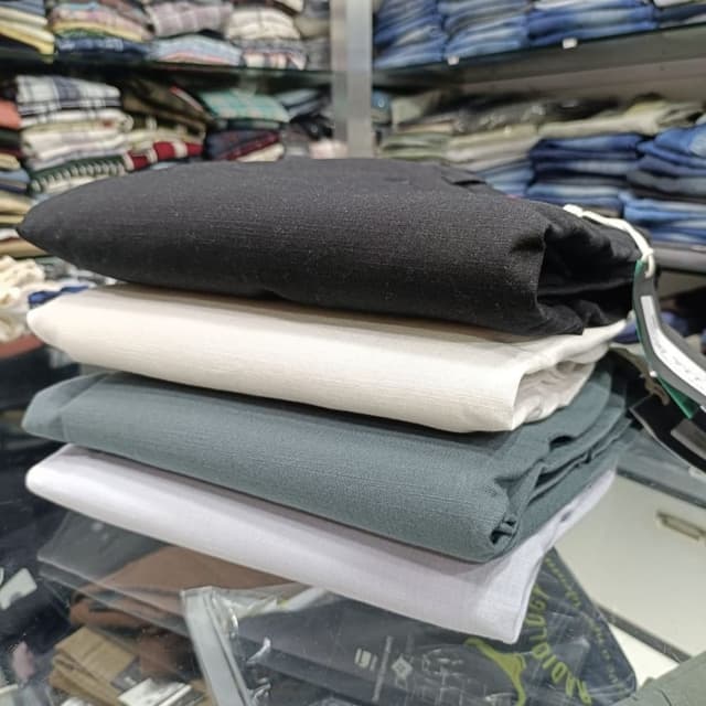 Black, Off-White, Teal, and Pale Gray Pants