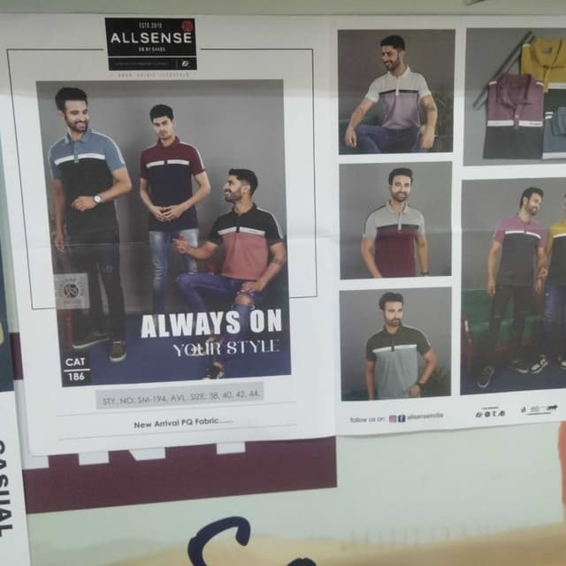 Black, blue, red, grey with white accents. Polo T-shirt