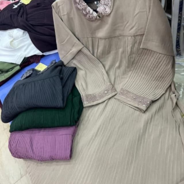 Beige, with accents of off-white and hints of embellishments Dress