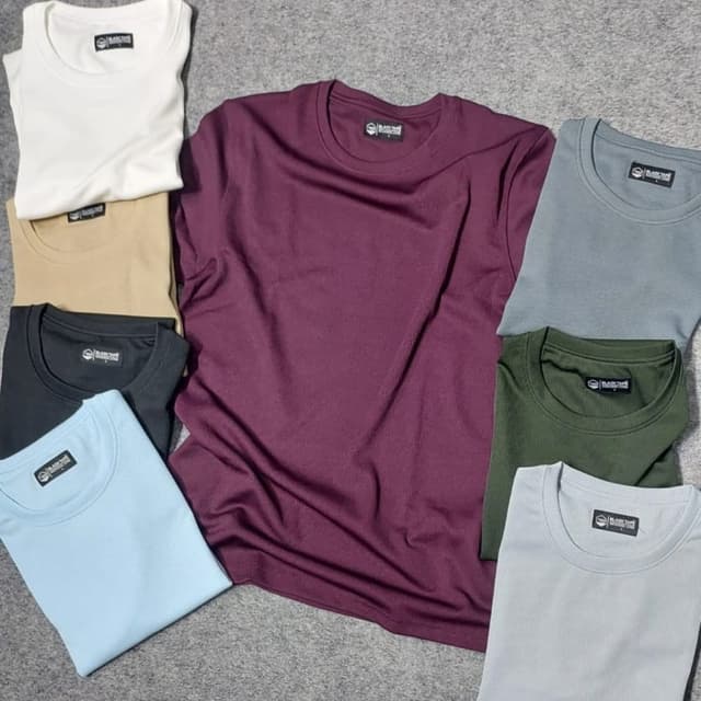 Various solid colors including white, beige, black, light blue, burgundy, olive green, and gray T-shirt