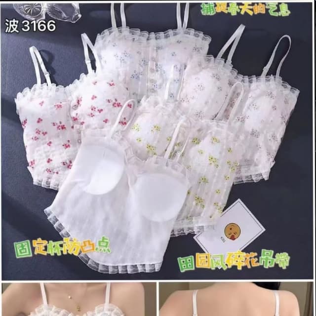 White, with floral patterns in red, blue, and yellow Camisole or Crop Top