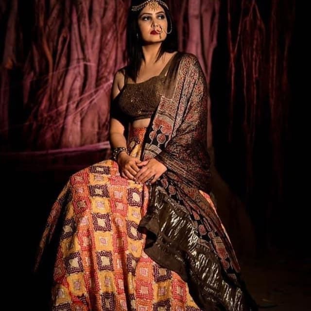 Red, orange, yellow, brown, and black Lehenga Choli