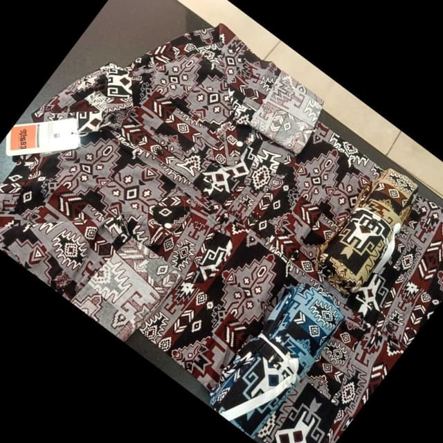 Gray, black, maroon, white, and brown. Shirt