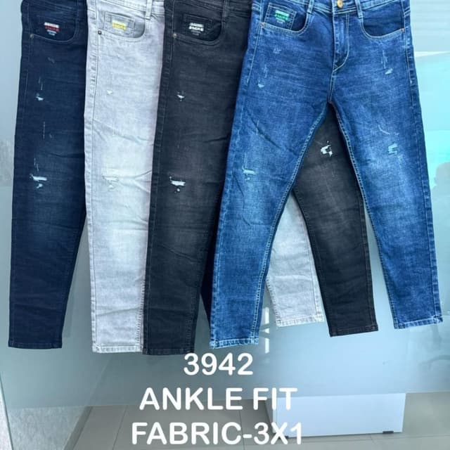 Various shades of denim, including dark blue, light gray, black, and medium blue. Jeans