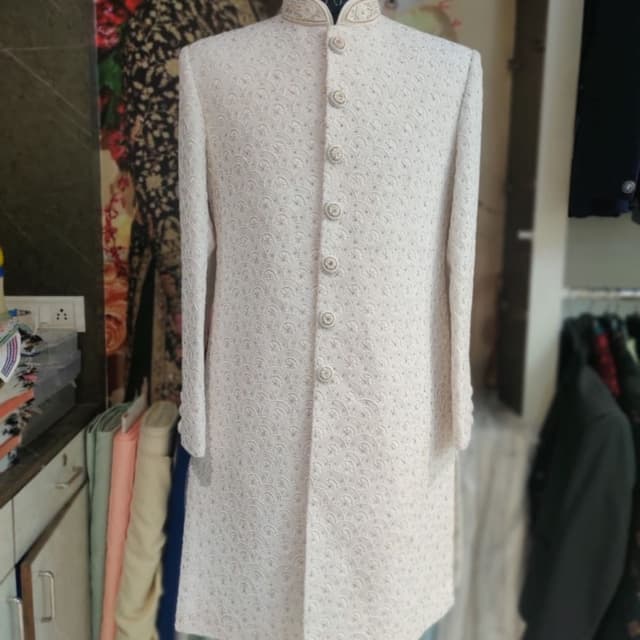Ivory/Off-White with subtle gold accents Sherwani