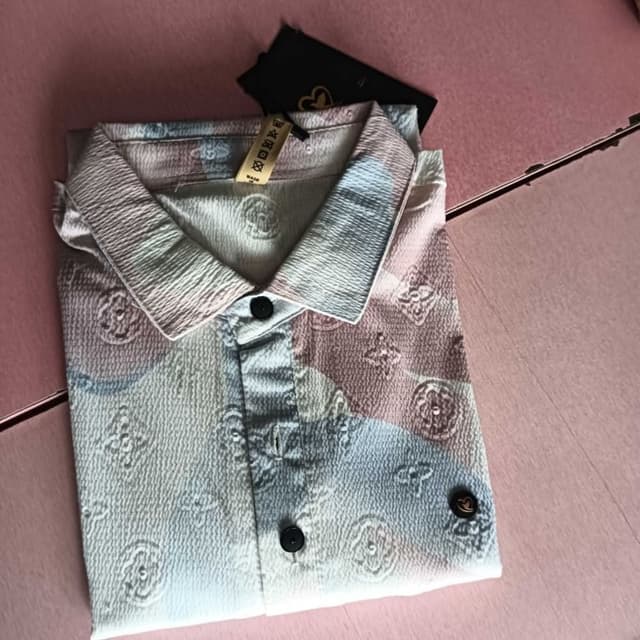 Pastel shades of pink, blue, and white with brown accents Shirt